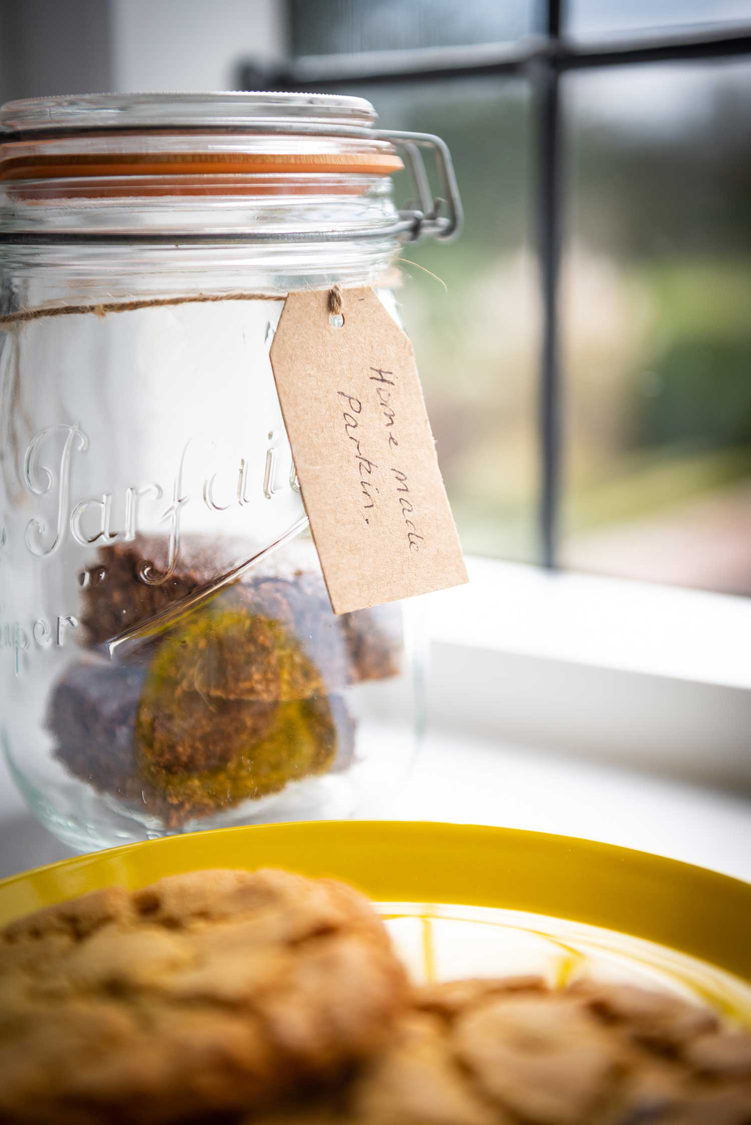 Jar containing home made parkin and cookies